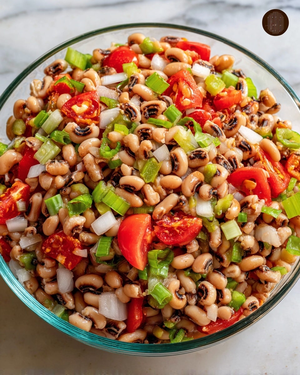 A glass bowl filled with a colorful mix of black-eyed peas and chopped vegetables sits on a white marbled surface. The salad has layers of tan and brown black-eyed peas with their distinctive dark spots, bright green diced celery and bell peppers, small pieces of white onion, and vibrant red cherry tomato halves scattered throughout. The textures vary from round and smooth beans to crunchy, diced vegetables, making the dish look fresh and healthy. photo taken with an iphone --ar 4:5 --v 7